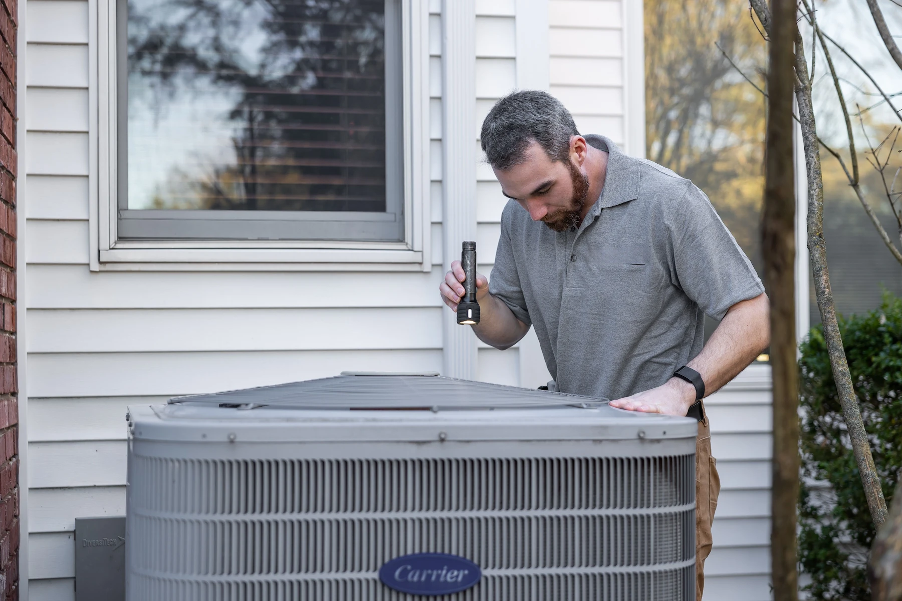 HVAC technician working on heating and cooling equipment